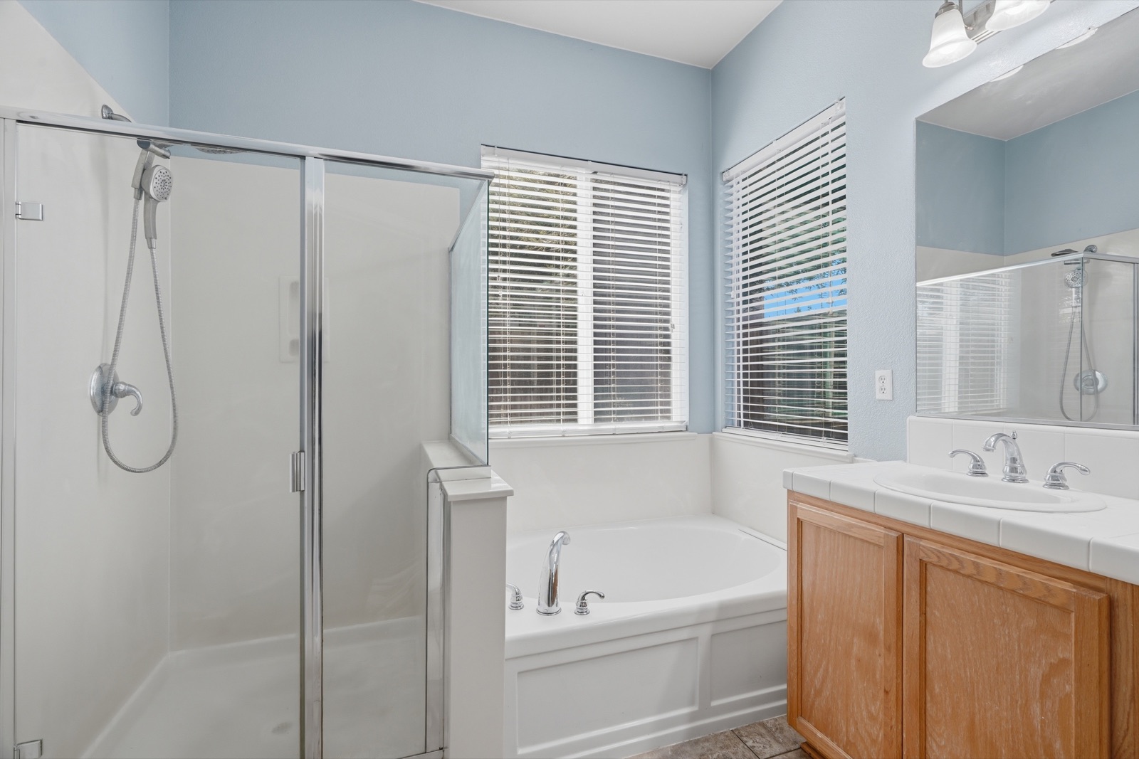 Bathroom with tub and separate shower