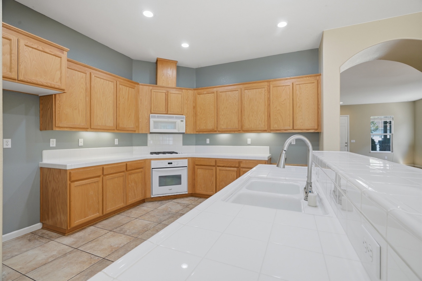 Wide view of the kitchen, counter space, and cabinetry