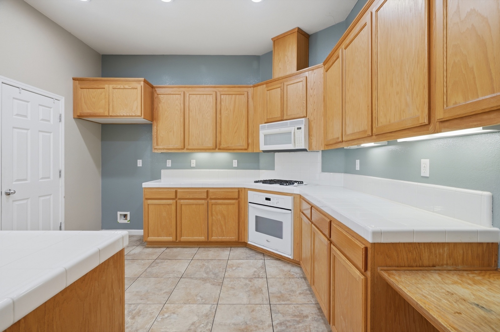 Kitchen with abundant wood cabinetry